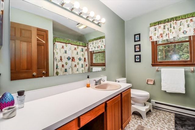 bathroom featuring tile patterned flooring, vanity, toilet, and a baseboard radiator