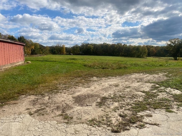 view of yard with a rural view