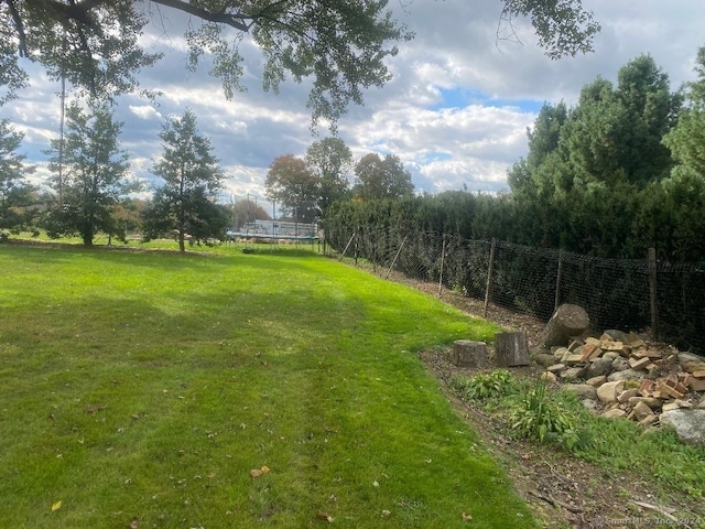 view of yard featuring a trampoline