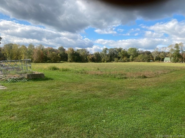 view of yard with a rural view