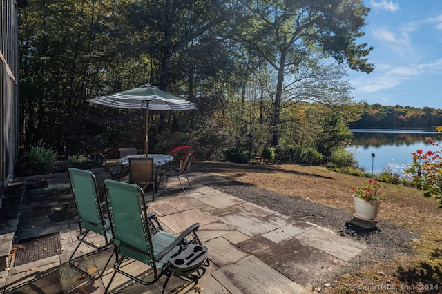 view of patio with a water view