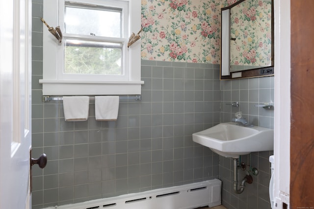 bathroom featuring a baseboard radiator and tile walls