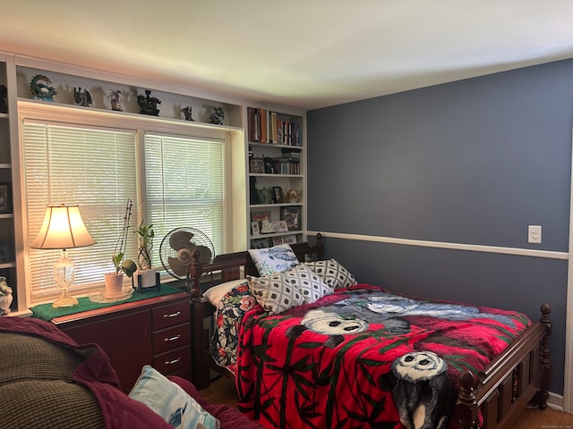 bedroom with hardwood / wood-style floors