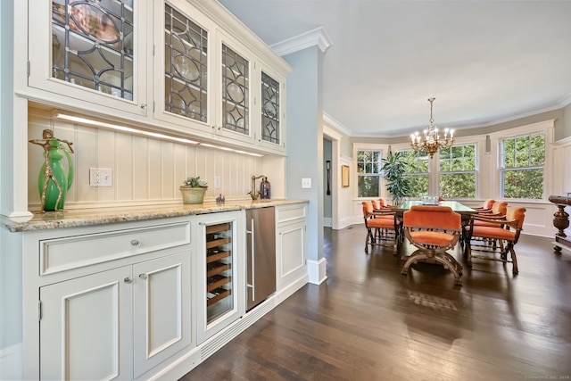 147 Old Church Rd, Greenwich, CT 06830 - indoor bar featuring crown molding, beverage cooler, dark wood-style flooring, a chandelier, and pendant lighting