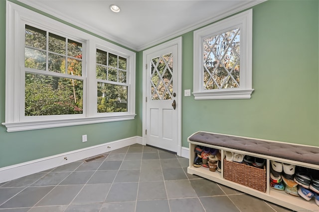 147 Old Church Rd, Greenwich, CT 06830 - foyer with ornamental molding, dark tile patterned flooring, and baseboards