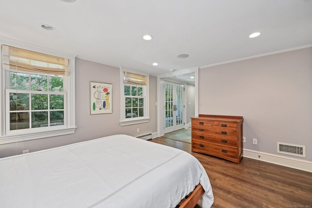147 Old Church Rd, Greenwich, CT 06830 - bedroom with a baseboard heating unit, wood finished floors, baseboards, recessed lighting, and access to outside