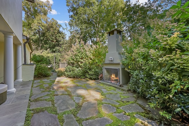 147 Old Church Rd, Greenwich, CT 06830 - view of patio with a warm lit fireplace
