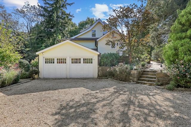 147 Old Church Rd, Greenwich, CT 06830 - view of front facade featuring stucco siding, a garage, and driveway