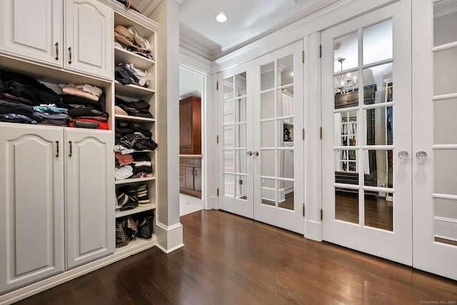 147 Old Church Rd, Greenwich, CT 06830 - walk in closet with french doors and dark wood-style floors