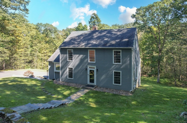 view of side of home featuring a yard