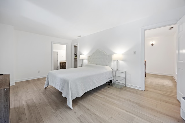 bedroom with light hardwood / wood-style flooring