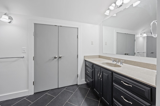 bathroom with vanity and tile patterned flooring