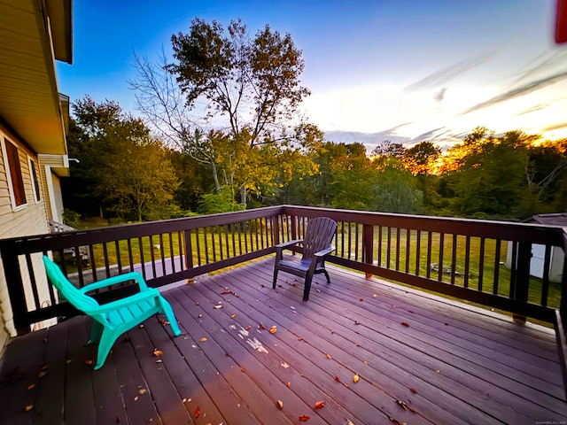 deck at dusk with a yard