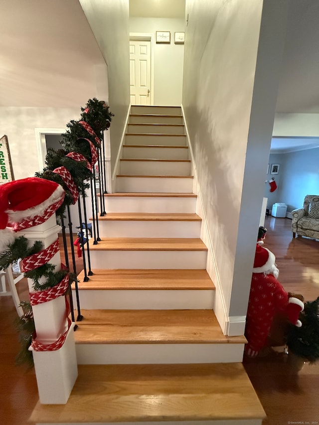 staircase featuring hardwood / wood-style floors