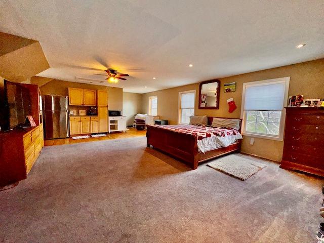 carpeted bedroom featuring stainless steel fridge, a textured ceiling, and ceiling fan