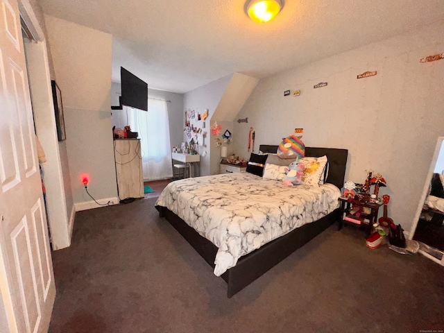 carpeted bedroom with a textured ceiling