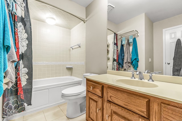 full bathroom featuring shower / bath combination with curtain, vanity, tile patterned flooring, and toilet