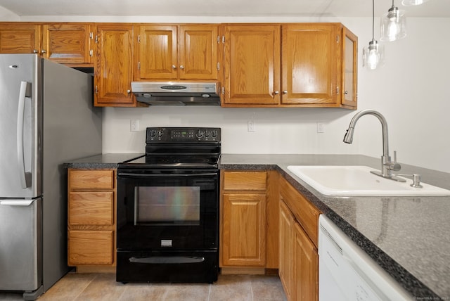 kitchen with electric range, sink, exhaust hood, white dishwasher, and stainless steel fridge