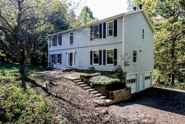 colonial home featuring a garage