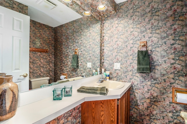 bathroom with vanity and toilet