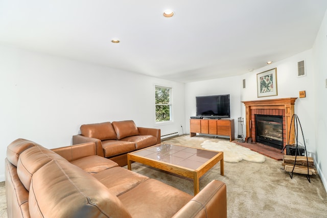 carpeted living room with a baseboard radiator and a brick fireplace