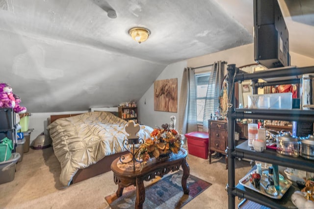 carpeted bedroom with vaulted ceiling