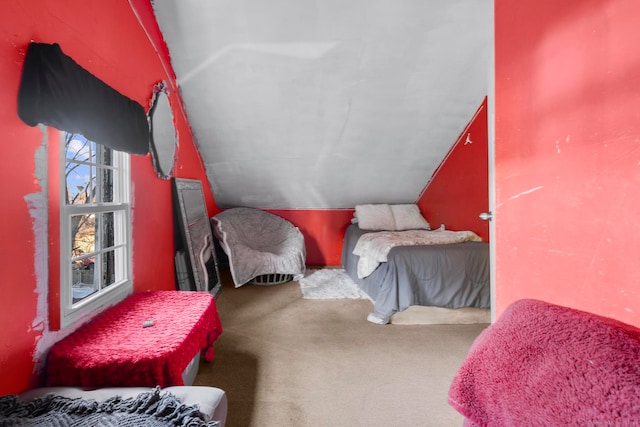 carpeted bedroom featuring vaulted ceiling