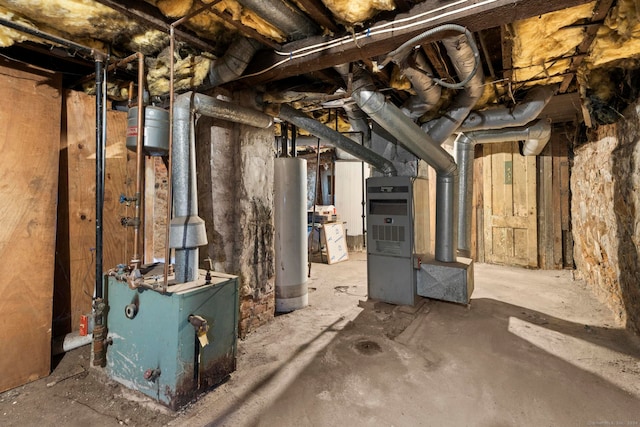 basement featuring water heater and heating unit