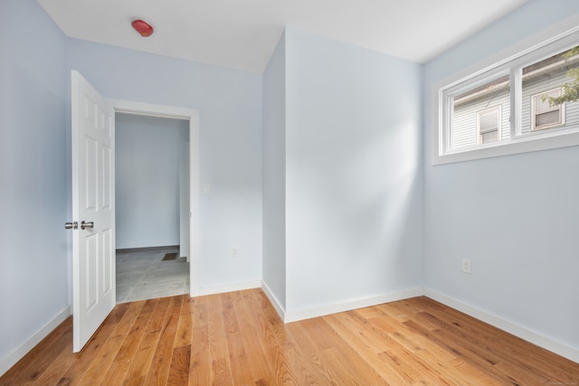 unfurnished room featuring light hardwood / wood-style flooring