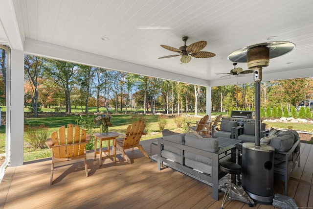 wooden terrace featuring ceiling fan