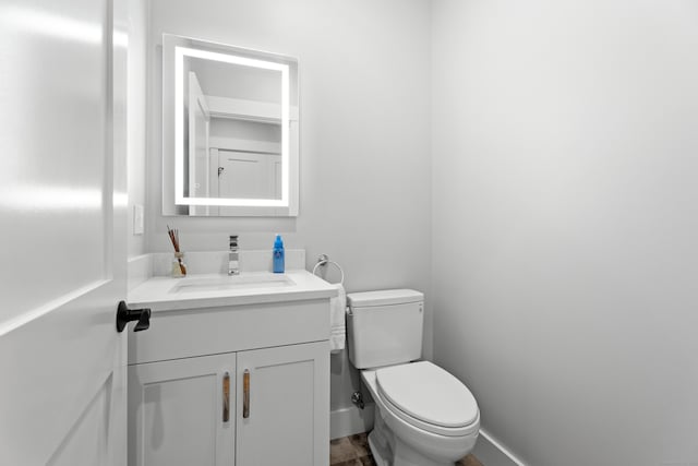 bathroom with vanity and toilet