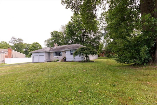 161 Dale Rd, Wethersfield, CT 06109 - back of property with a garage and a chimney
