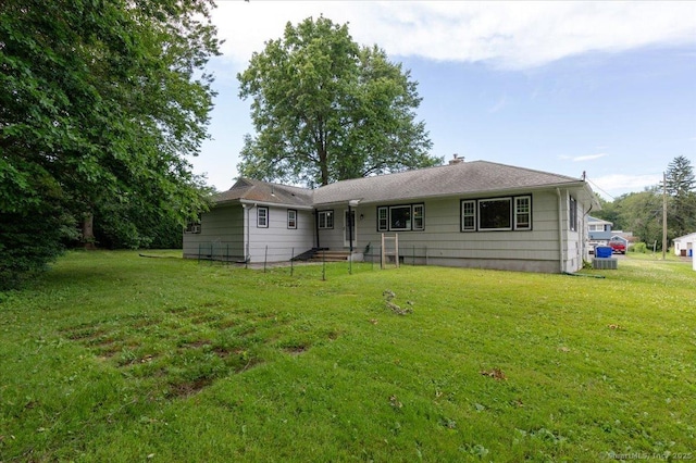 161 Dale Rd, Wethersfield, CT 06109 - rear view of house with a yard and a chimney