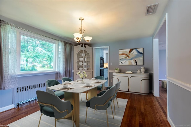 161 Dale Rd, Wethersfield, CT 06109 - dining area featuring radiator and dark wood-style floors