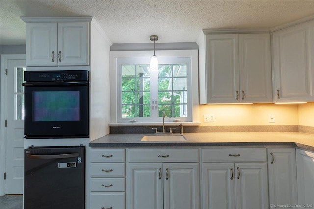 161 Dale Rd, Wethersfield, CT 06109 - kitchen featuring black oven, dishwashing machine, a textured ceiling, and white cabinetry