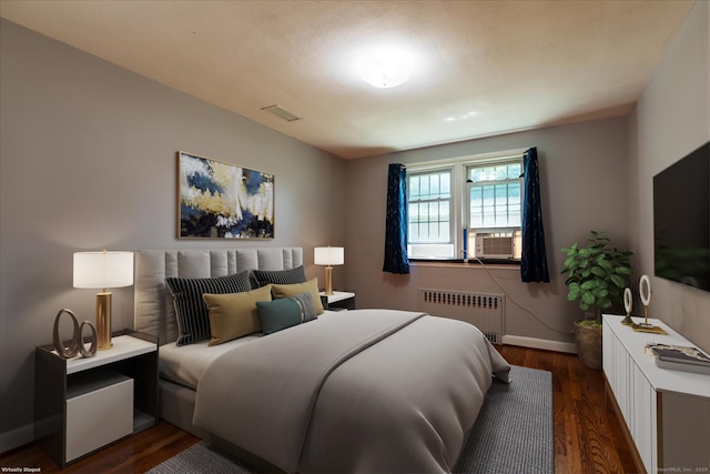 161 Dale Rd, Wethersfield, CT 06109 - bedroom with radiator heating unit, cooling unit, and dark wood-style floors