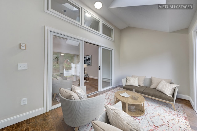 living room featuring vaulted ceiling and dark hardwood / wood-style floors