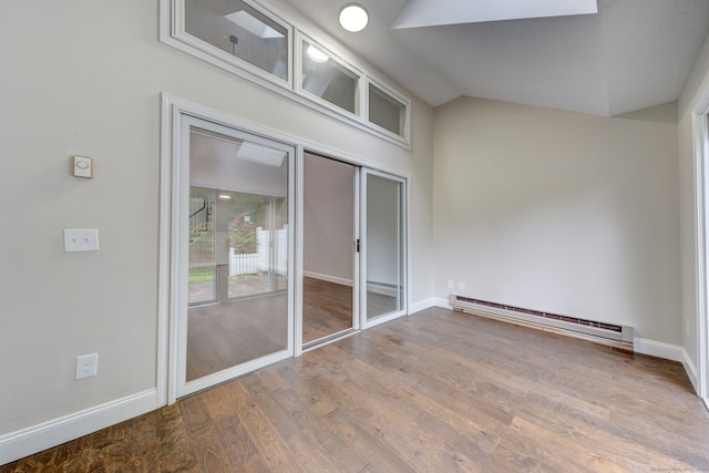 interior space with a balcony and baseboard heating