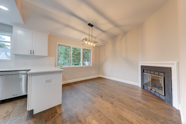 kitchen featuring white cabinetry, dishwasher, dark hardwood / wood-style flooring, and plenty of natural light