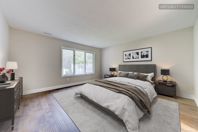 bedroom with wood-type flooring