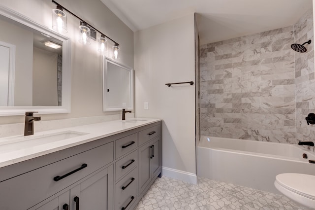 full bathroom featuring tiled shower / bath combo, vanity, toilet, and tile patterned floors