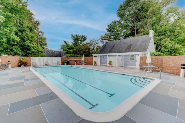 view of swimming pool featuring a patio area