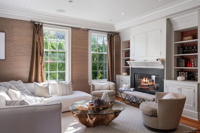 living area featuring light wood-type flooring, crown molding, wood ceiling, and built in features