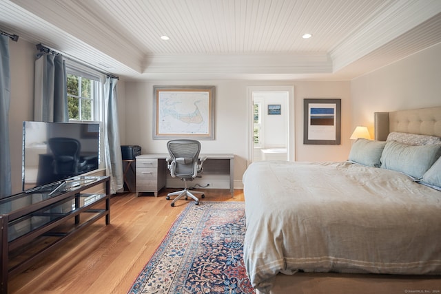 bedroom with hardwood / wood-style flooring, a tray ceiling, and wood ceiling