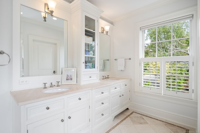 bathroom featuring crown molding, vanity, tile patterned floors, and plenty of natural light