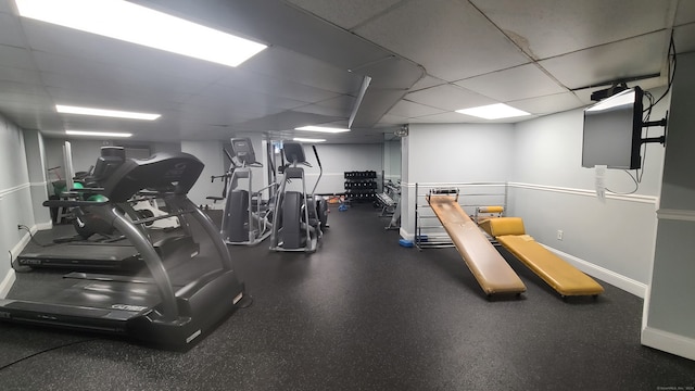 workout area featuring a paneled ceiling