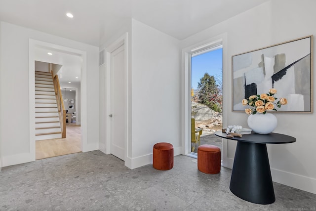 hallway with light hardwood / wood-style flooring