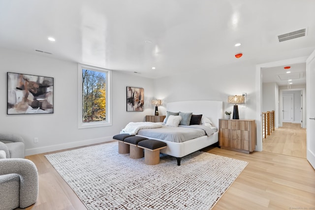 bedroom with light hardwood / wood-style floors