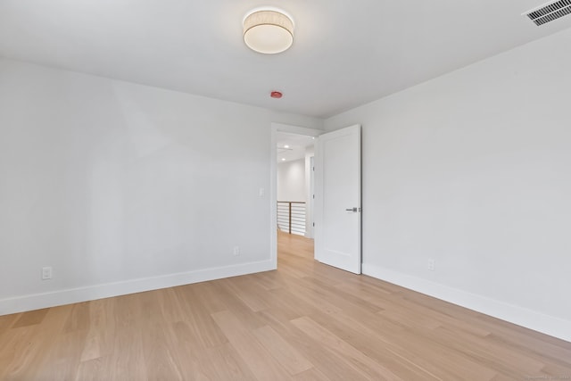 unfurnished room featuring light wood-type flooring