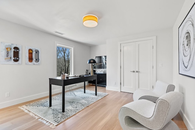 office space with light wood-type flooring